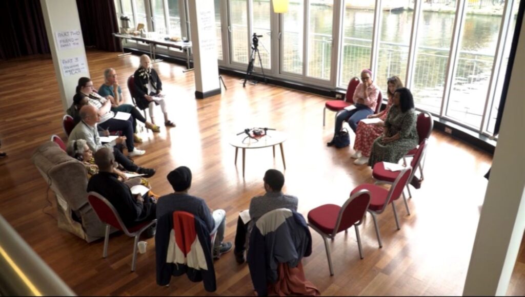 Group of people sitting in a circle