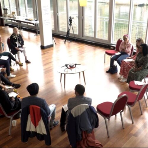 Group of people sitting in a circle