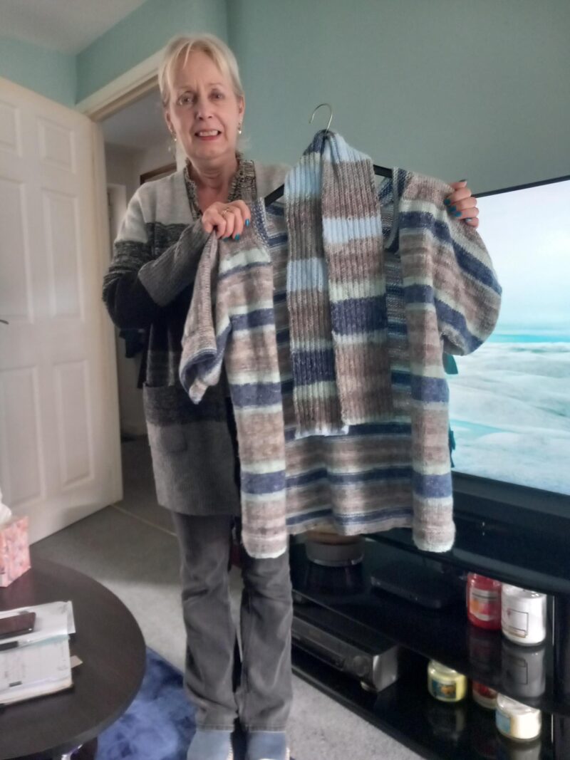 Photo of Susan showing some of her knitting