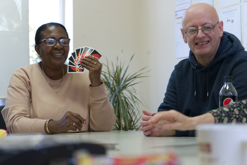 Man and Woman playing UNO
