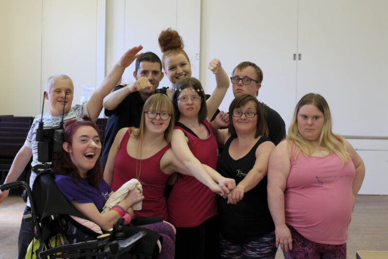 Image of group of people smiling and posing together