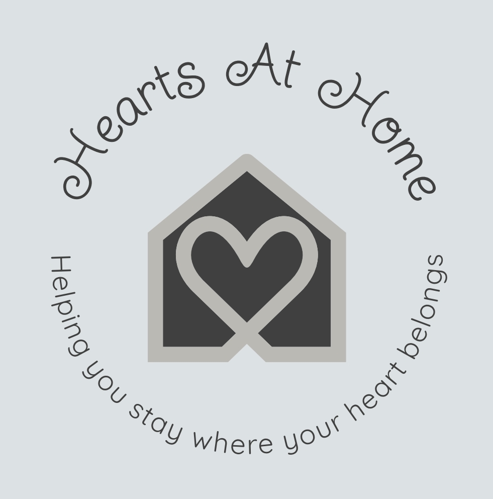 A logo that represents hearts within the home. This is a gentle and warming logo with no bold colours.