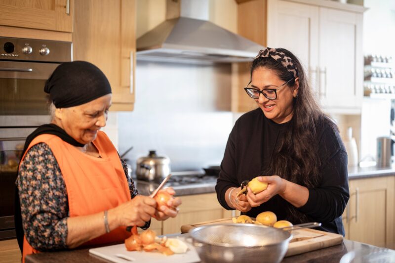 Photo of people cooking in kitchen