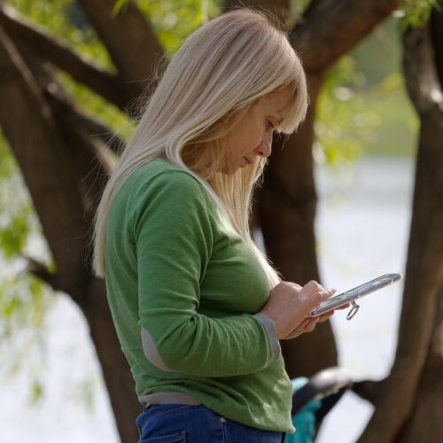 A woman looking at a mobile phone