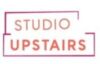 Studio Upstairs Charity Logo: A stylized graphic representing our charity's name in text surrounding by an abstract frame