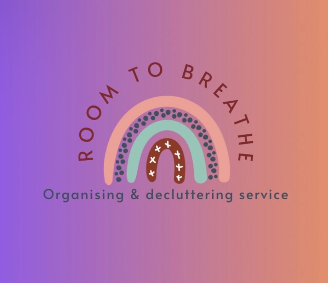 Logo for Room to Breathe Organising & Decluttering Service. A stylised rainbow made up of soft pastel arches and decorative dots sits beneath the business name “Room to Breathe”. The tagline “Organising & decluttering service” appears below. The logo is displayed on a purple-to-peach gradient background, conveying a calm, welcoming and supportive approach to home organisation and decluttering.