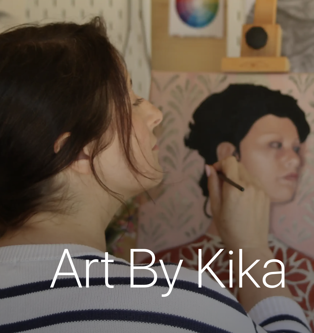 Logo showing artist at work. 