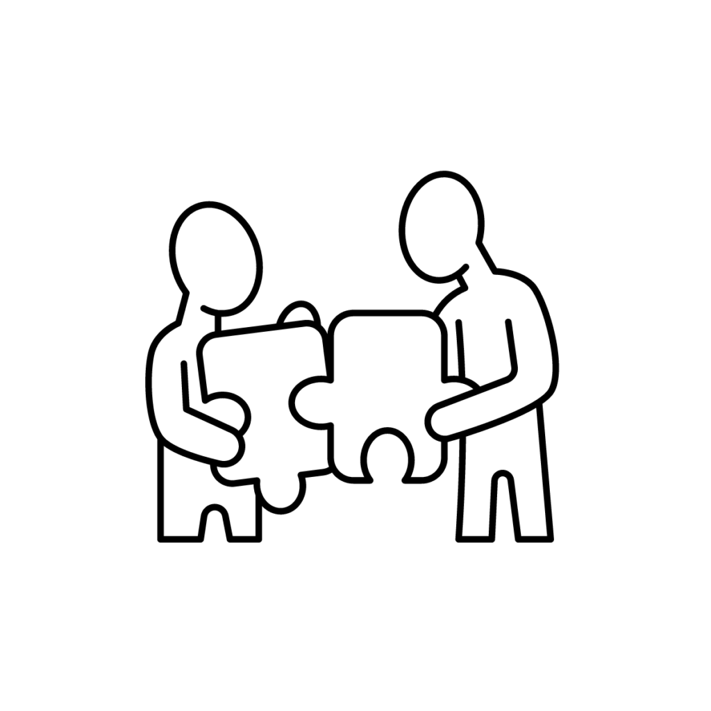 Two people holding jigsaw pieces