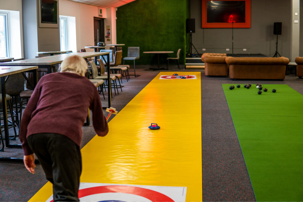 Man playing curling