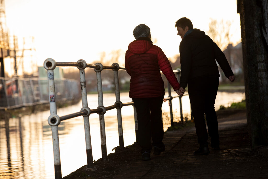 Couple walking by canal