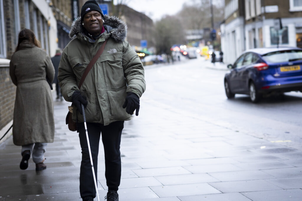 Man with cane on street