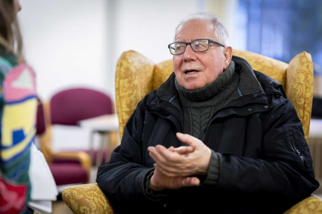 Man chatting in chair