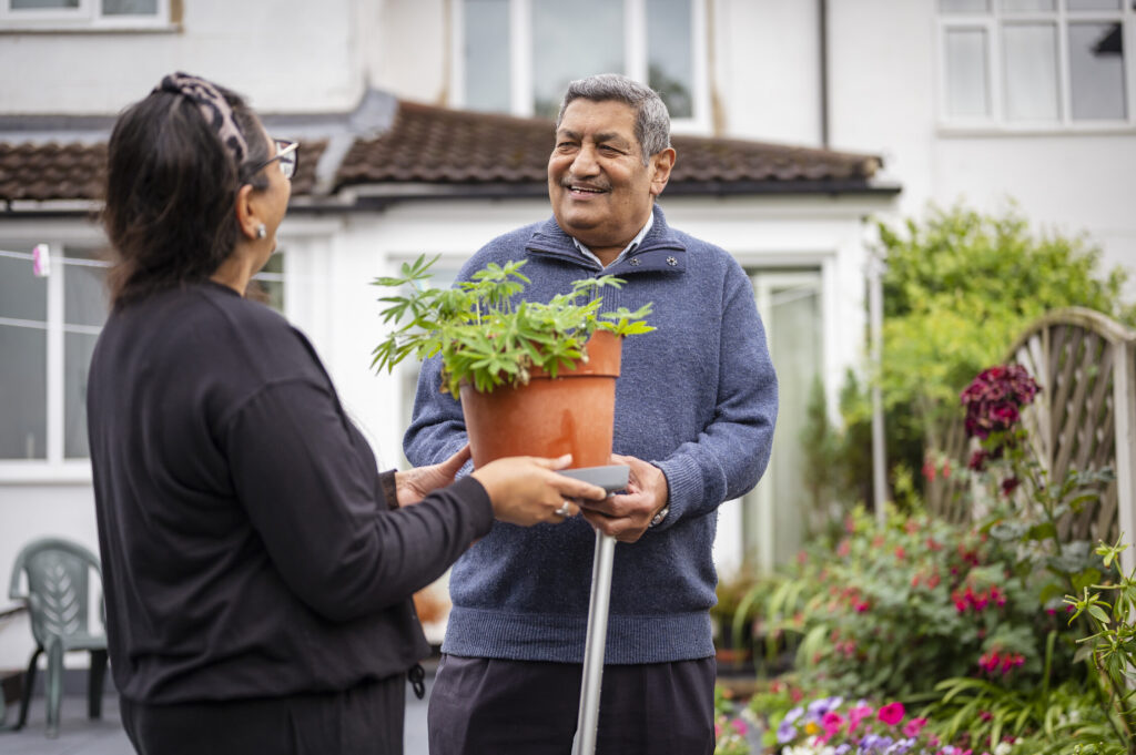 Man and woman chatting in a garden