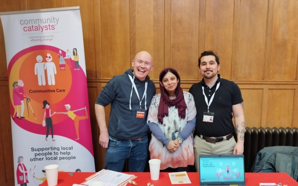 Andy, Bhupinder and Joe standing at an exhibition stand