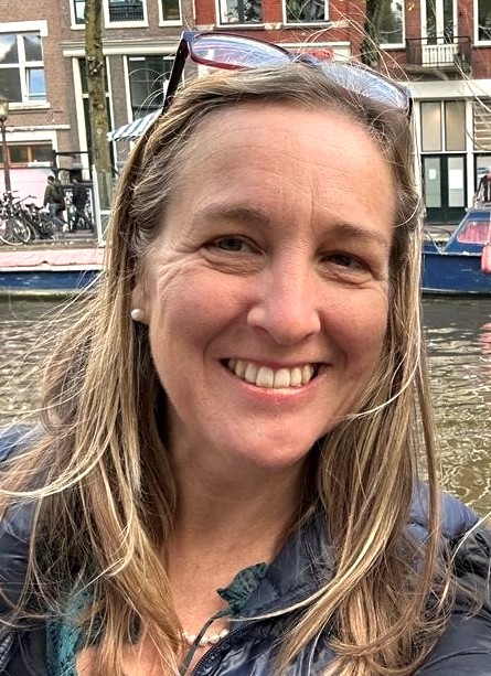 A woman smiling at the camera
