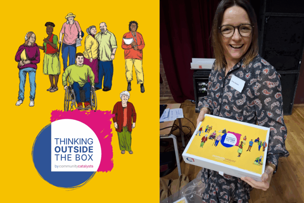 Image of a woman holding a box and smiling.