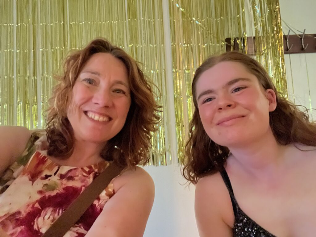 Two women smiling.