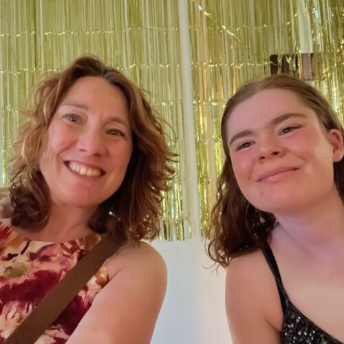 Two women smiling.