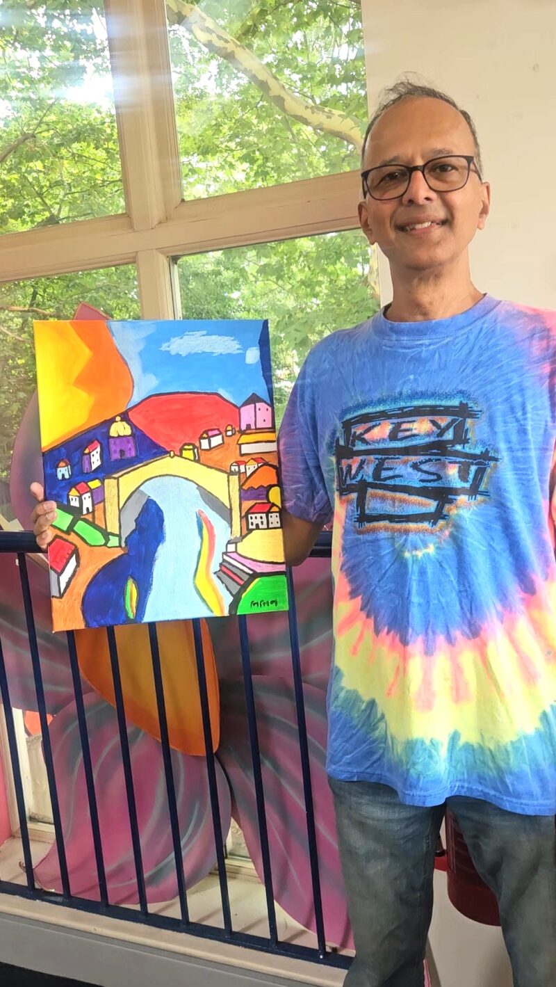 Person holding a painting