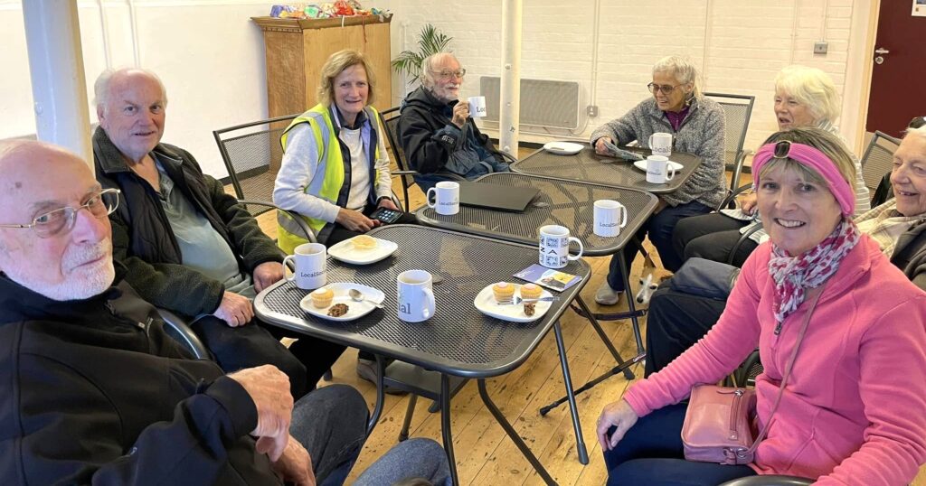 Group of people sitting around a table.