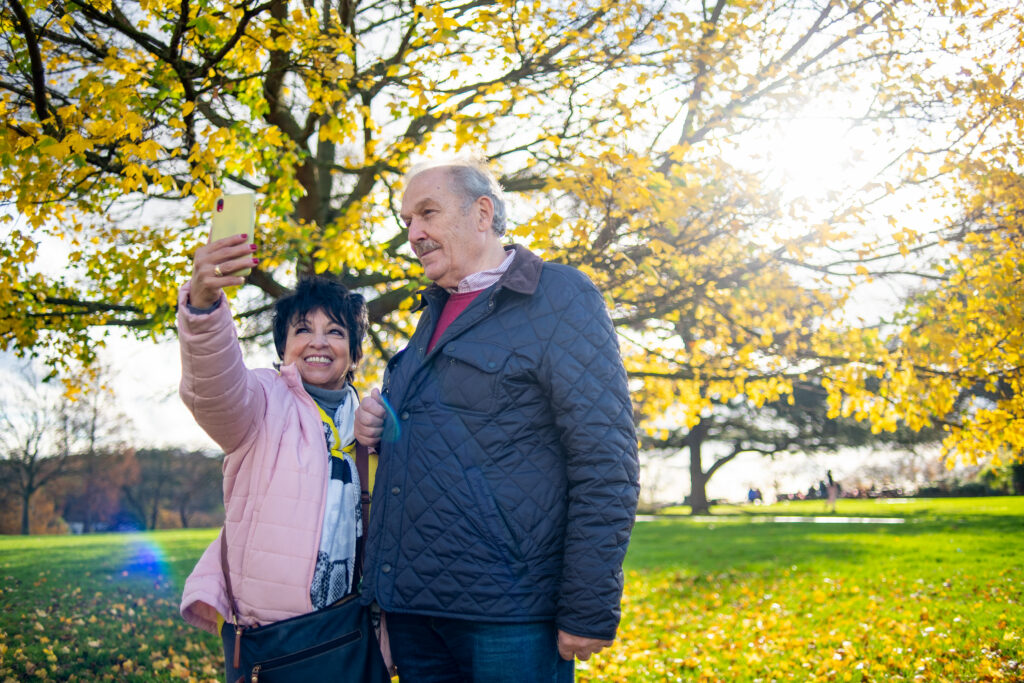 Two people in a park taking a selfie