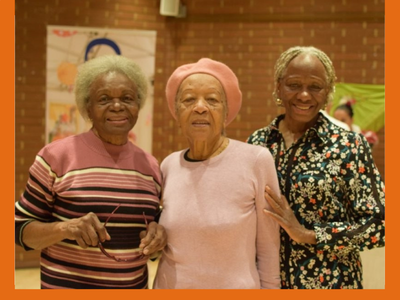 Three women at a community event